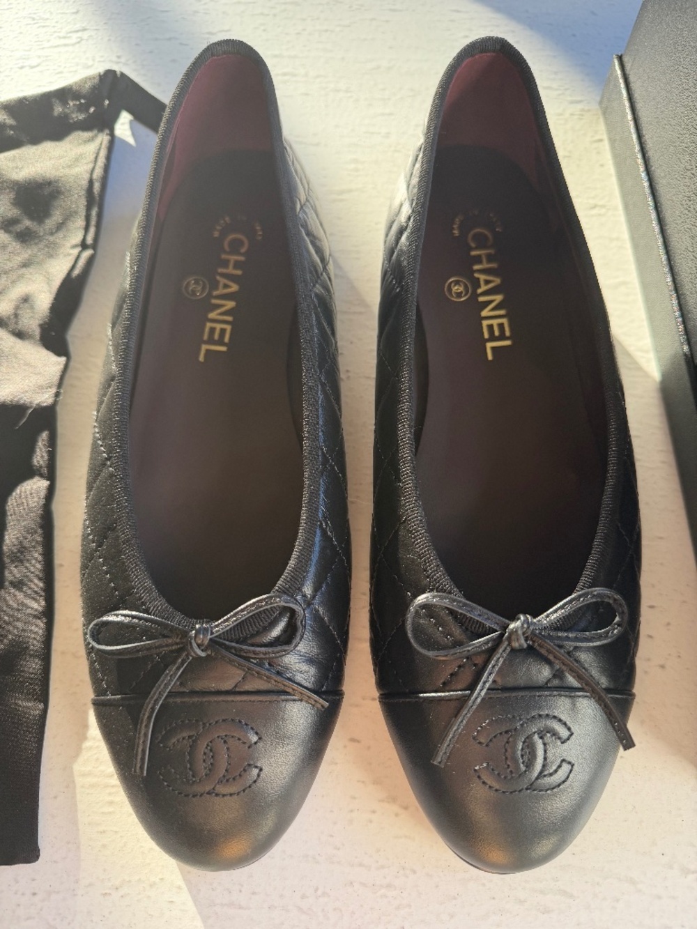 Chanel black quilted leather flats